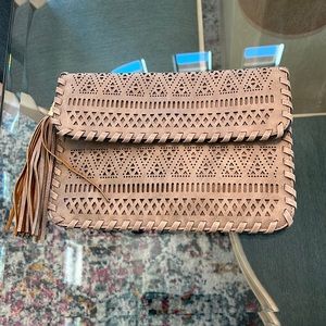 Tan beige color, removable strap clutch. No return